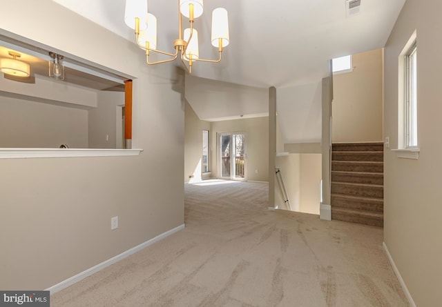 hallway featuring baseboards, carpet, visible vents, and a notable chandelier