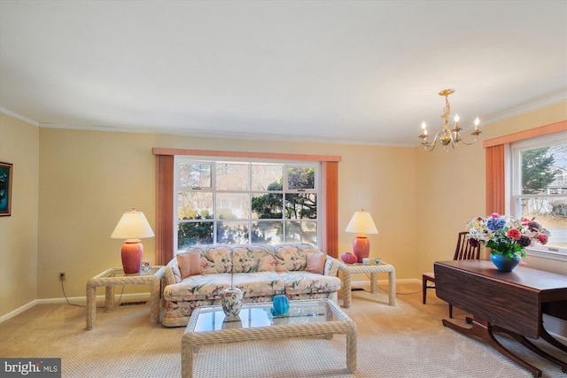 carpeted living area with ornamental molding, a notable chandelier, and baseboards