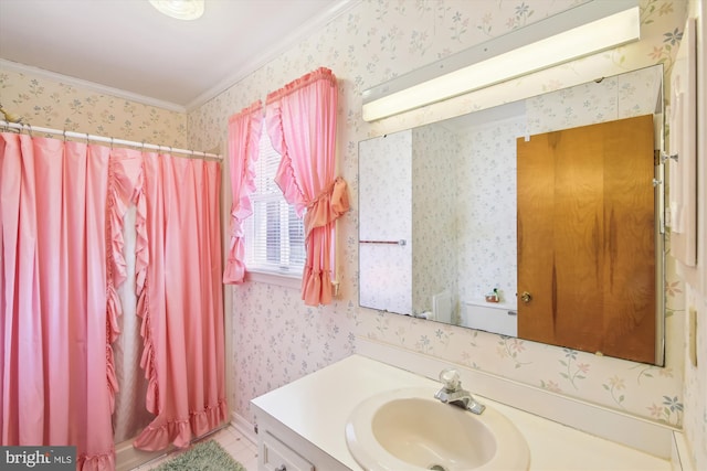 bathroom featuring curtained shower, crown molding, vanity, and wallpapered walls