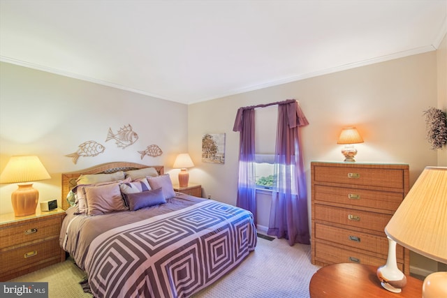 bedroom with light carpet and crown molding