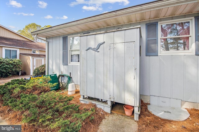 view of side of property with an outbuilding