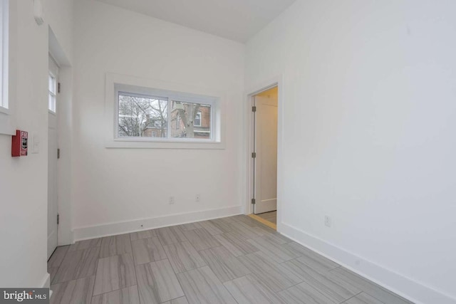 empty room featuring baseboards