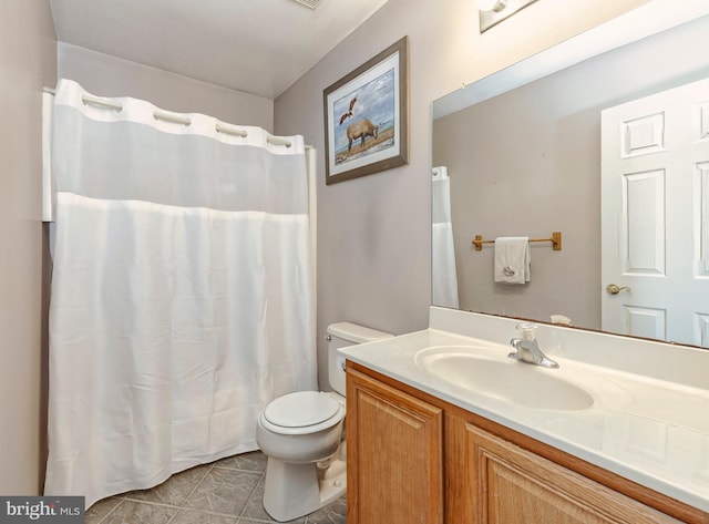 full bath featuring a shower with shower curtain, vanity, toilet, and tile patterned floors