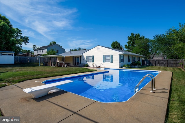 view of swimming pool with a patio, a lawn, a fenced backyard, and a fenced in pool