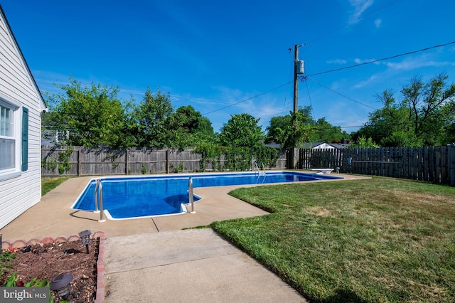 view of swimming pool featuring a lawn, a patio area, a fenced backyard, and a fenced in pool