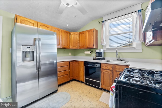 kitchen featuring black dishwasher, light floors, a sink, stainless steel fridge, and under cabinet range hood