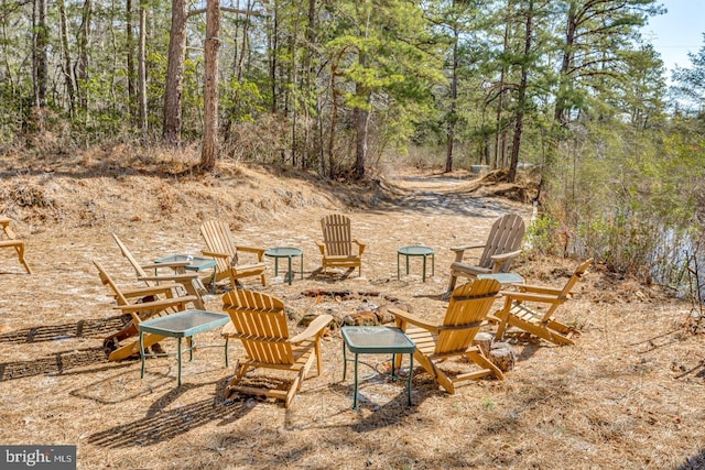 view of patio with a view of trees