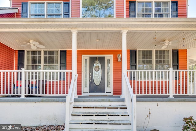 view of exterior entry with covered porch and a ceiling fan