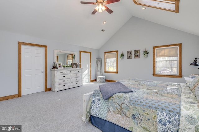 bedroom with baseboards, visible vents, ceiling fan, carpet flooring, and high vaulted ceiling