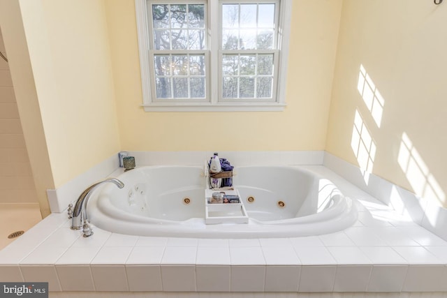 full bath with a whirlpool tub