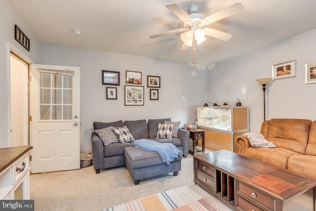 living room with light carpet and a ceiling fan