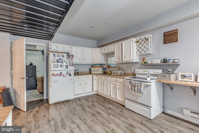 kitchen with light countertops, white cabinets, a sink, light wood-type flooring, and white appliances