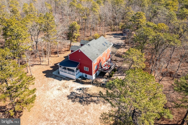 drone / aerial view with a view of trees