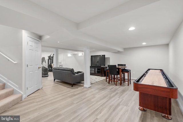 living area featuring light wood-type flooring, stairway, baseboards, and recessed lighting