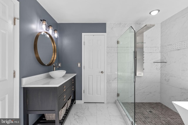 full bathroom with vanity, marble finish floor, and a tile shower