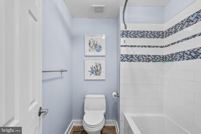 bathroom featuring visible vents, baseboards, toilet, and tile patterned flooring