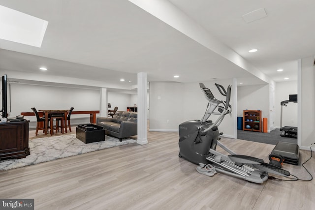 exercise room with recessed lighting, baseboards, and wood finished floors