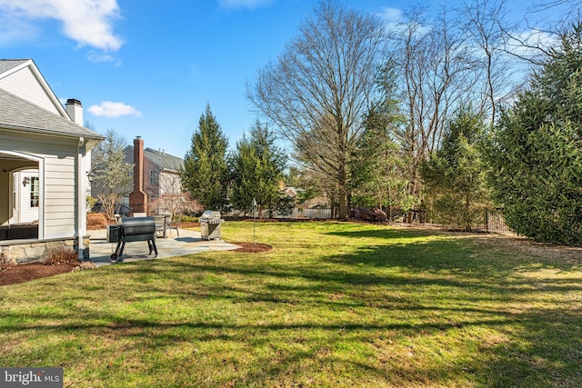 view of yard with a patio area and fence