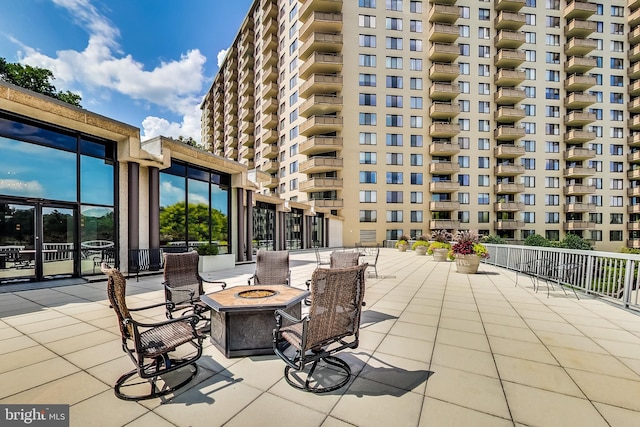 view of patio / terrace featuring an outdoor fire pit