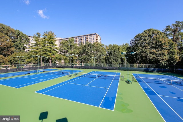 view of tennis court with fence