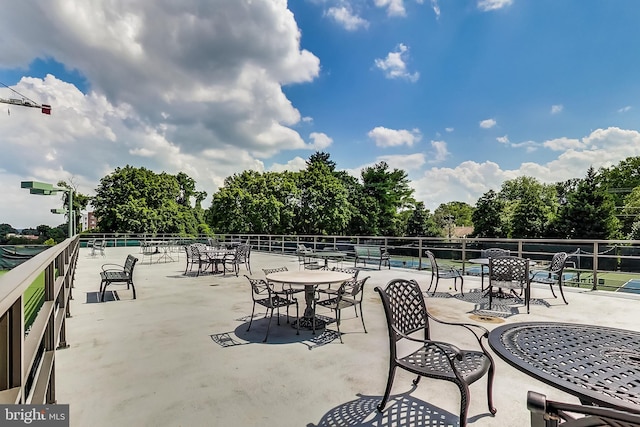 view of patio featuring fence