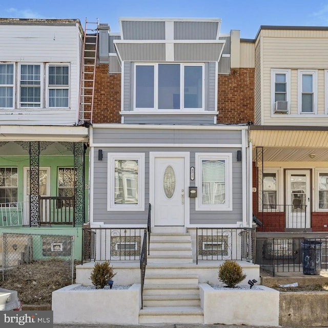 multi unit property featuring a porch