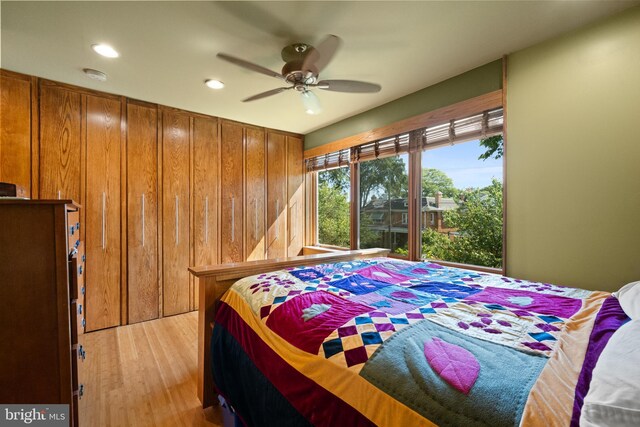 5724 4th St NW, Washington, DC 20011 - bedroom with light wood finished floors, recessed lighting, wooden walls, and a ceiling fan