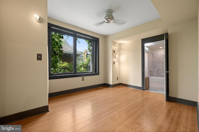 5724 4th St NW, Washington, DC 20011 - empty room with ceiling fan, wood-type flooring, and baseboards