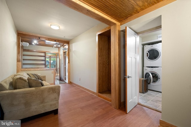 5724 4th St NW, Washington, DC 20011 - living room featuring stacked washer and clothes dryer, wood finished floors, baseboards, and wood ceiling