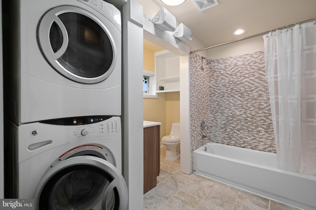 5724 4th St NW, Washington, DC 20011 - full bathroom featuring estacked washer and dryer, toilet, shower / tub combo with curtain, vanity, and tile patterned flooring
