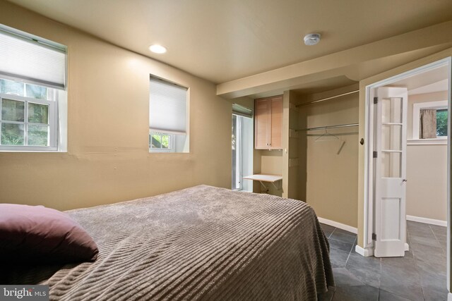 5724 4th St NW, Washington, DC 20011 - bedroom with a closet, dark tile patterned flooring, baseboards, and recessed lighting
