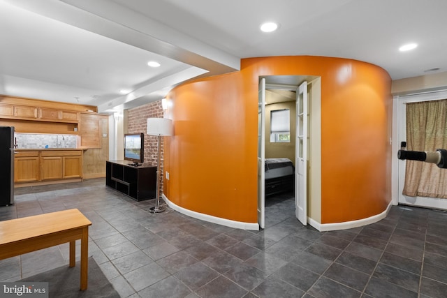 5724 4th St NW, Washington, DC 20011 - unfurnished living room featuring baseboards and recessed lighting