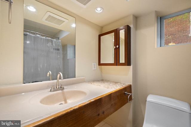 5724 4th St NW, Washington, DC 20011 - full bathroom featuring recessed lighting, toilet, and vanity