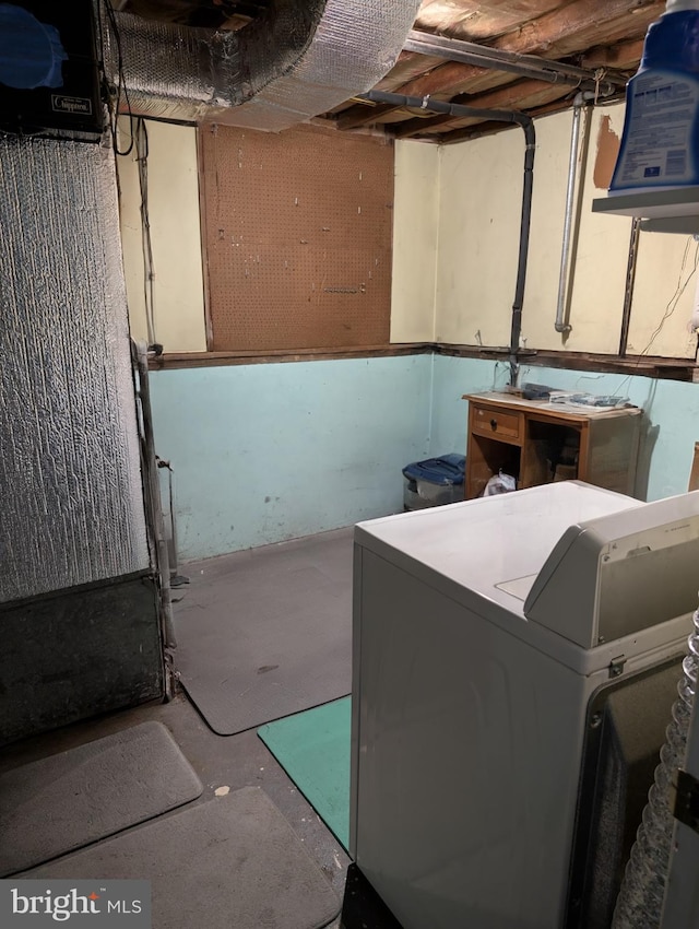 clothes washing area featuring washer / dryer and laundry area