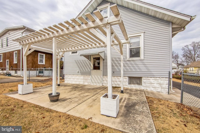 view of patio / terrace with fence and a pergola