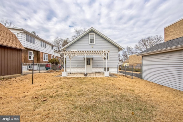 rear view of house with a fenced backyard, a patio, a lawn, and a pergola