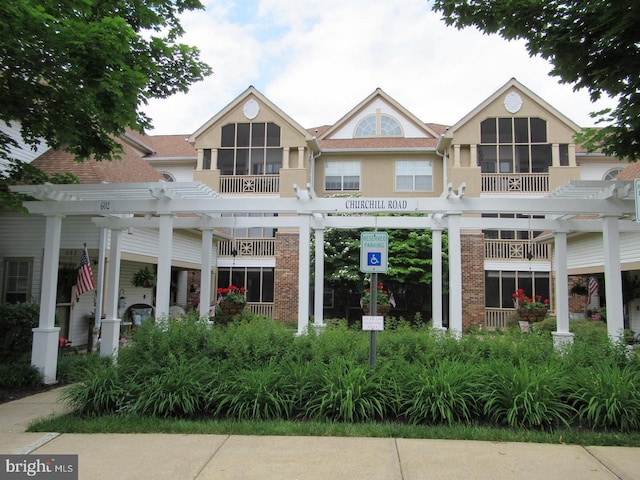 view of front of home with a pergola