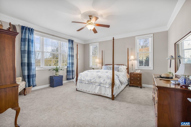 bedroom featuring light carpet, baseboards, ornamental molding, and a ceiling fan