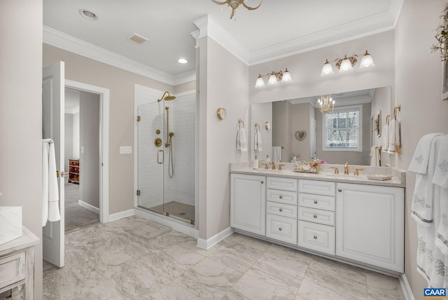 bathroom with a stall shower, marble finish floor, and a sink