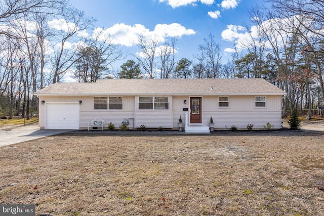 single story home with roof with shingles, driveway, and an attached garage