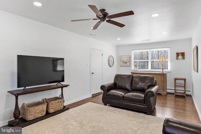 living area with ceiling fan, recessed lighting, dark wood finished floors, and baseboards