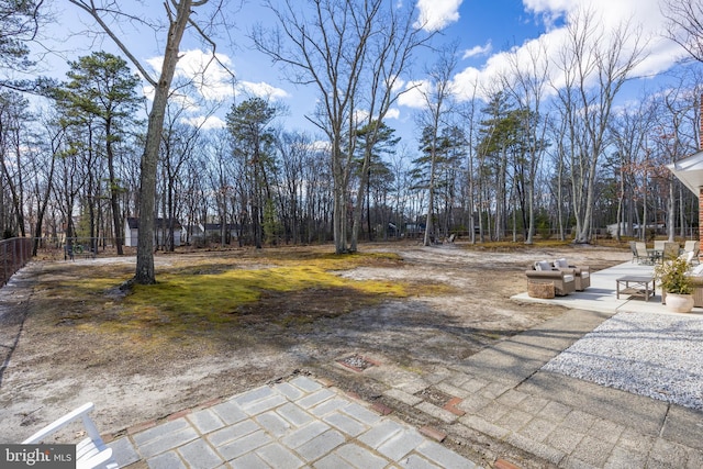 view of yard with fence and a patio