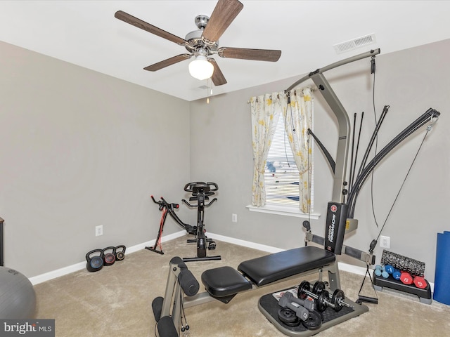 workout room featuring a ceiling fan, baseboards, visible vents, and carpet flooring