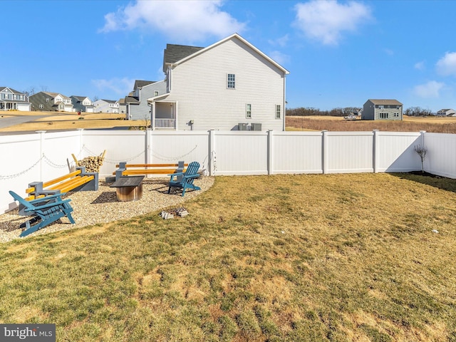 view of yard with a fenced backyard and a residential view