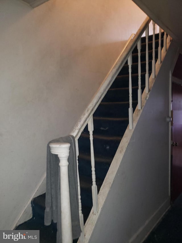 stairway with baseboards