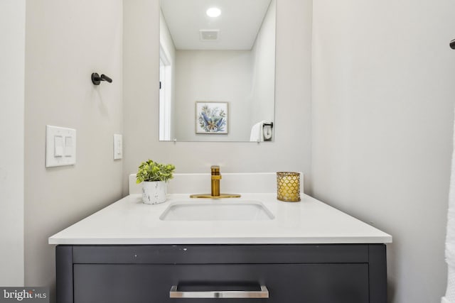 bathroom with visible vents and vanity