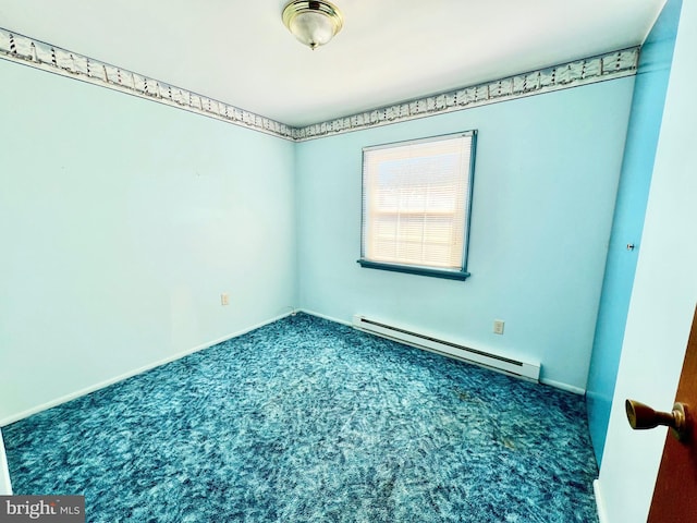 unfurnished room with a baseboard radiator and carpet floors