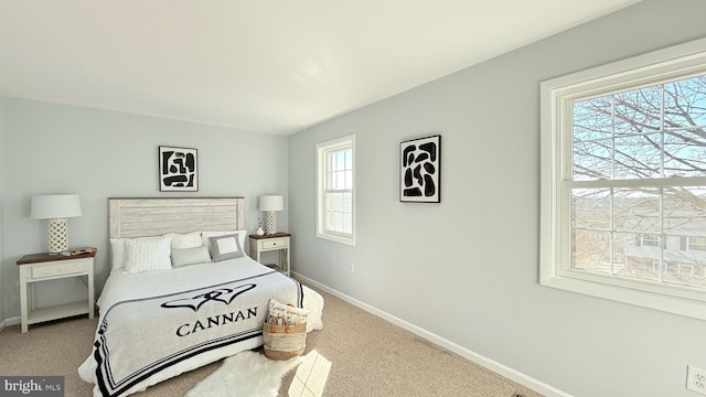 bedroom featuring carpet floors and baseboards