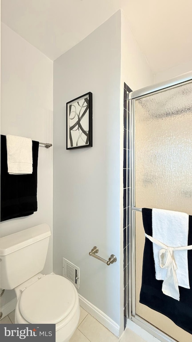 full bath with baseboards, visible vents, toilet, tile patterned flooring, and a shower stall