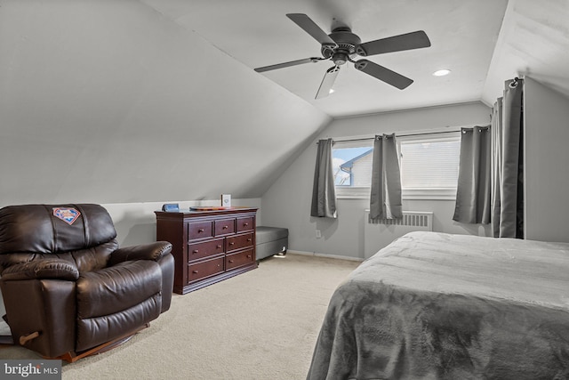 bedroom with radiator, baseboards, lofted ceiling, ceiling fan, and light colored carpet